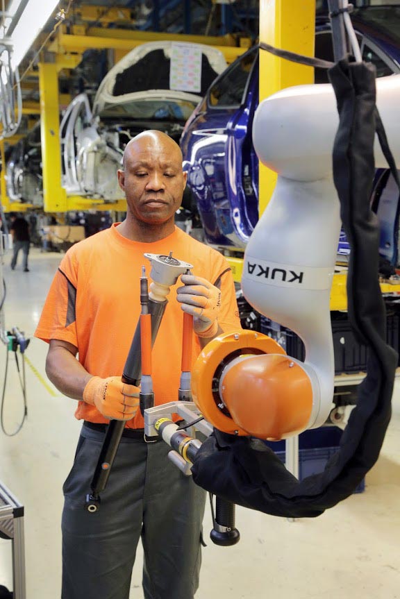 Car Workers And Mini Robots Work Hand In Hand 2
