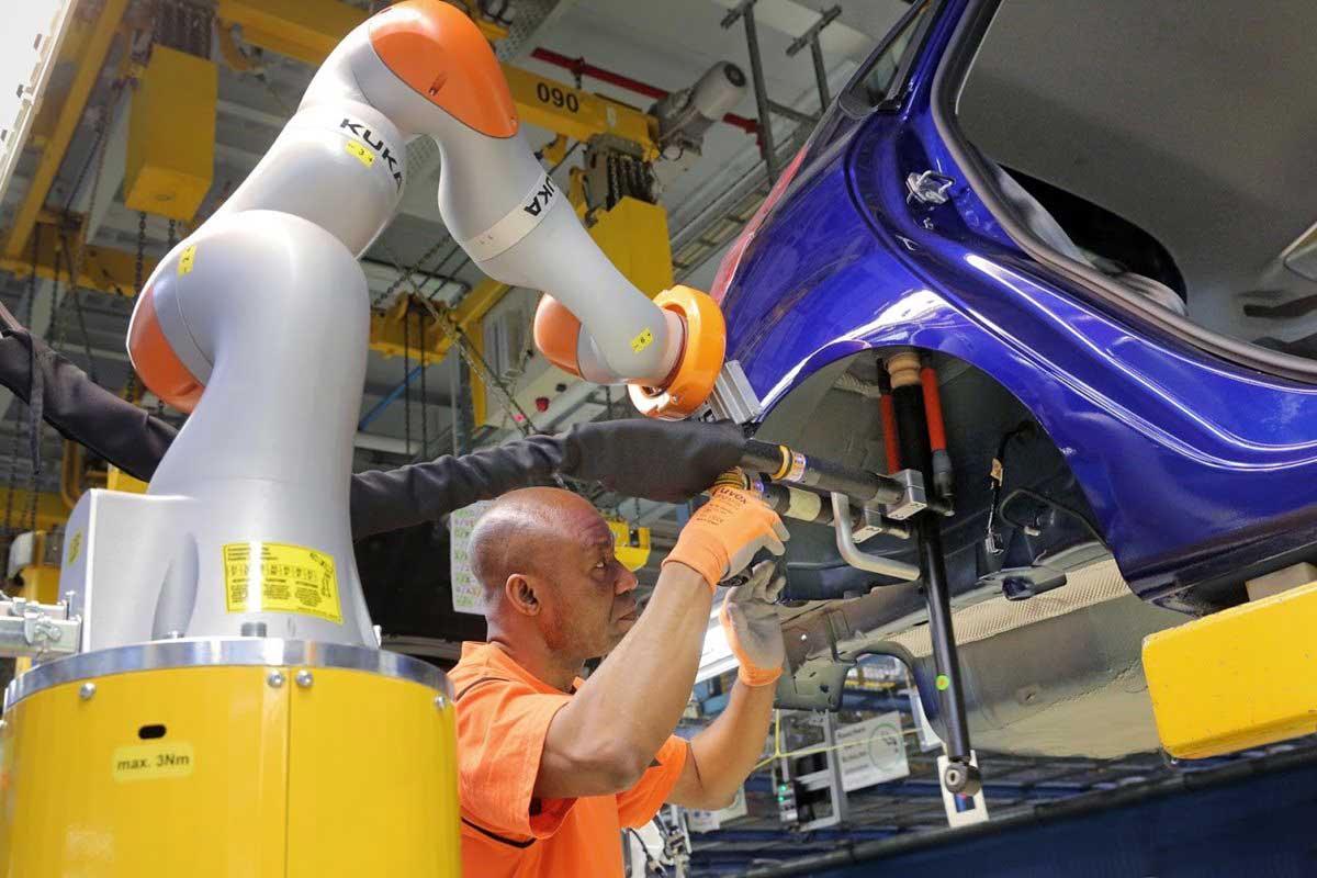 Car Workers And Mini Robots Work Hand In Hand 3